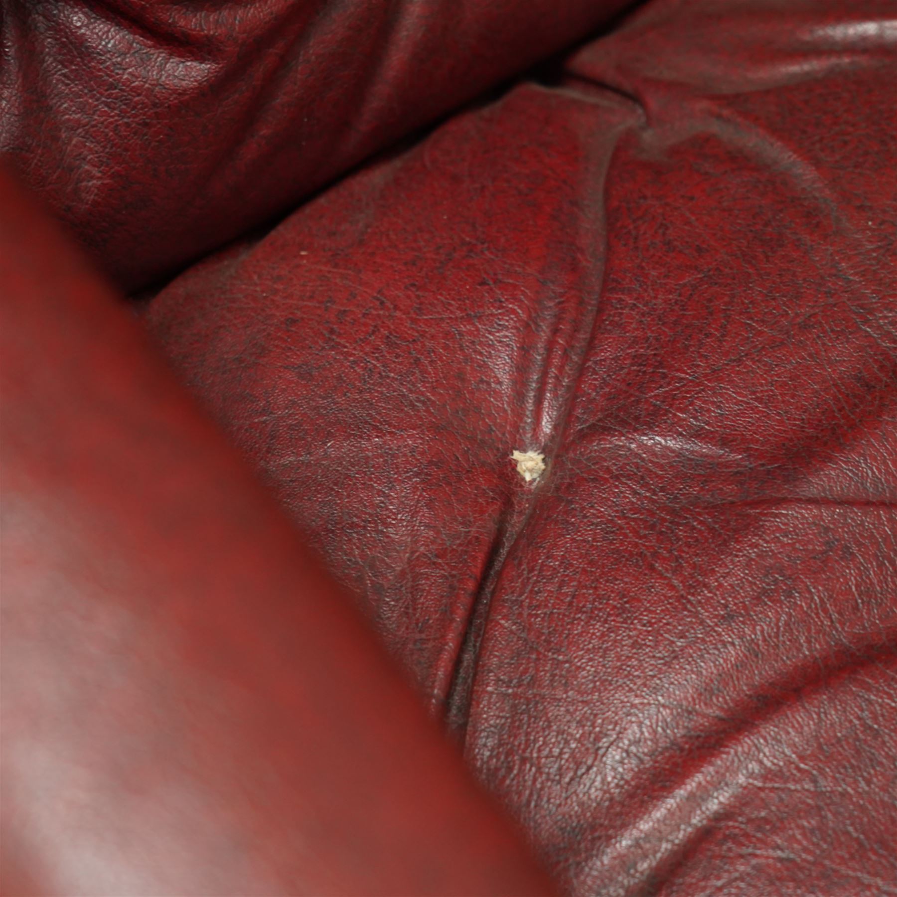 Impressive pair of mid-Victorian oak throne or hall chairs, arched backs on fluted supports with a deep buttoned upholstered panel and upholstered curved arms over fluted seat rails and tapering turned front legs with original brass and brown porcelain castors, and out-swept rear supports