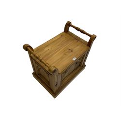 Gothic style pine stool with hinged box seat, decorated with flower head motifs, plinth base