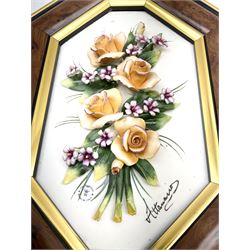 Set of three Capodimonte wall plaques, depicting floral decoration in octagonal frames with gilt edging, largest plaque H48, two small plaques H31cm.    