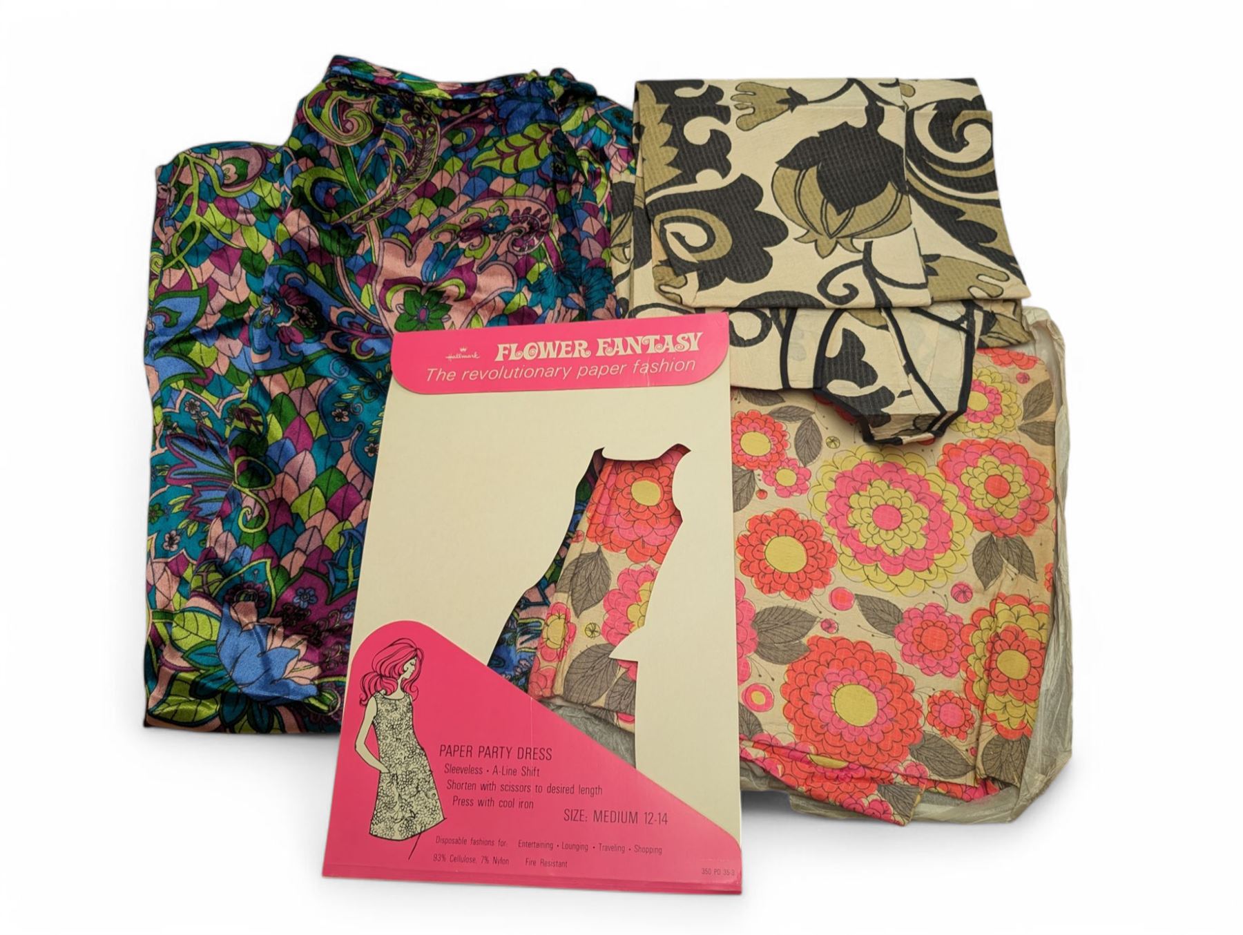 Two 1960s paper dresses and a bright patterned velvet skirt