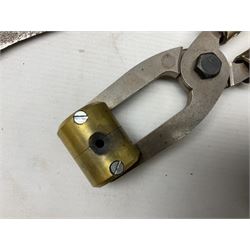 Assorted militaria including ten leather or canvas cartridge and other belts, maroon beret with 17th Lancers cap badge, modern bullet mould, leather and brass shot flask, two knives, shell cases, boomerang etc; in tin deed box