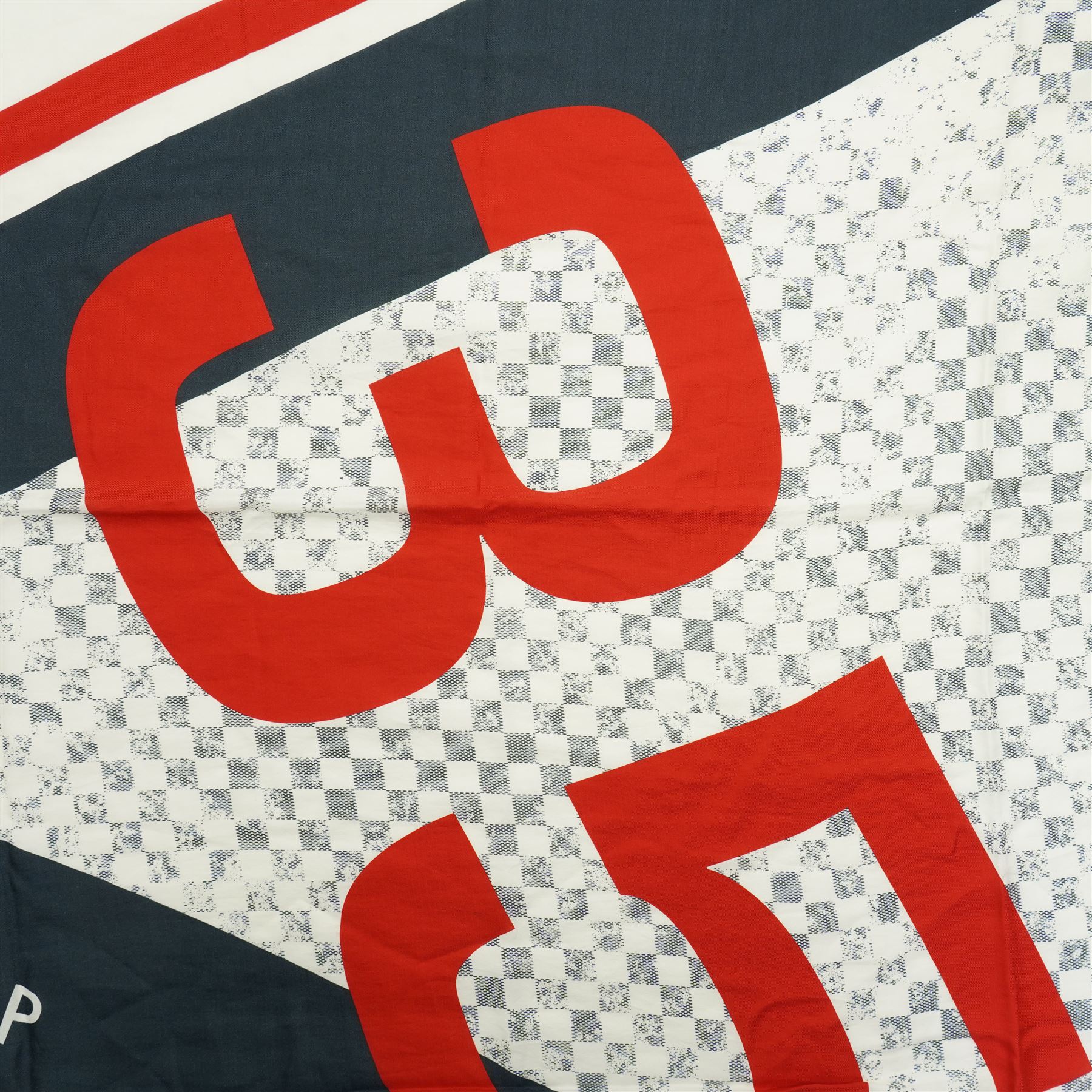 Louis Vuitton America’s Cup stole, the Damier-pattern ground with navy, red and white graphic panels, large ‘35’ motif and Louis Vuitton and America’s Cup lettering, fringed ends, label stamped Louis Vuitton Paris, 65% cotton and 35% silk, made in Italy, 201cm x 66cm