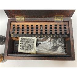 Two Post Office hand stamps 'Heversham Milnthorpe Cumbria' and 'Cimla Neath', together with two hand stamp bodies and various date numbers, housed in a fitted box