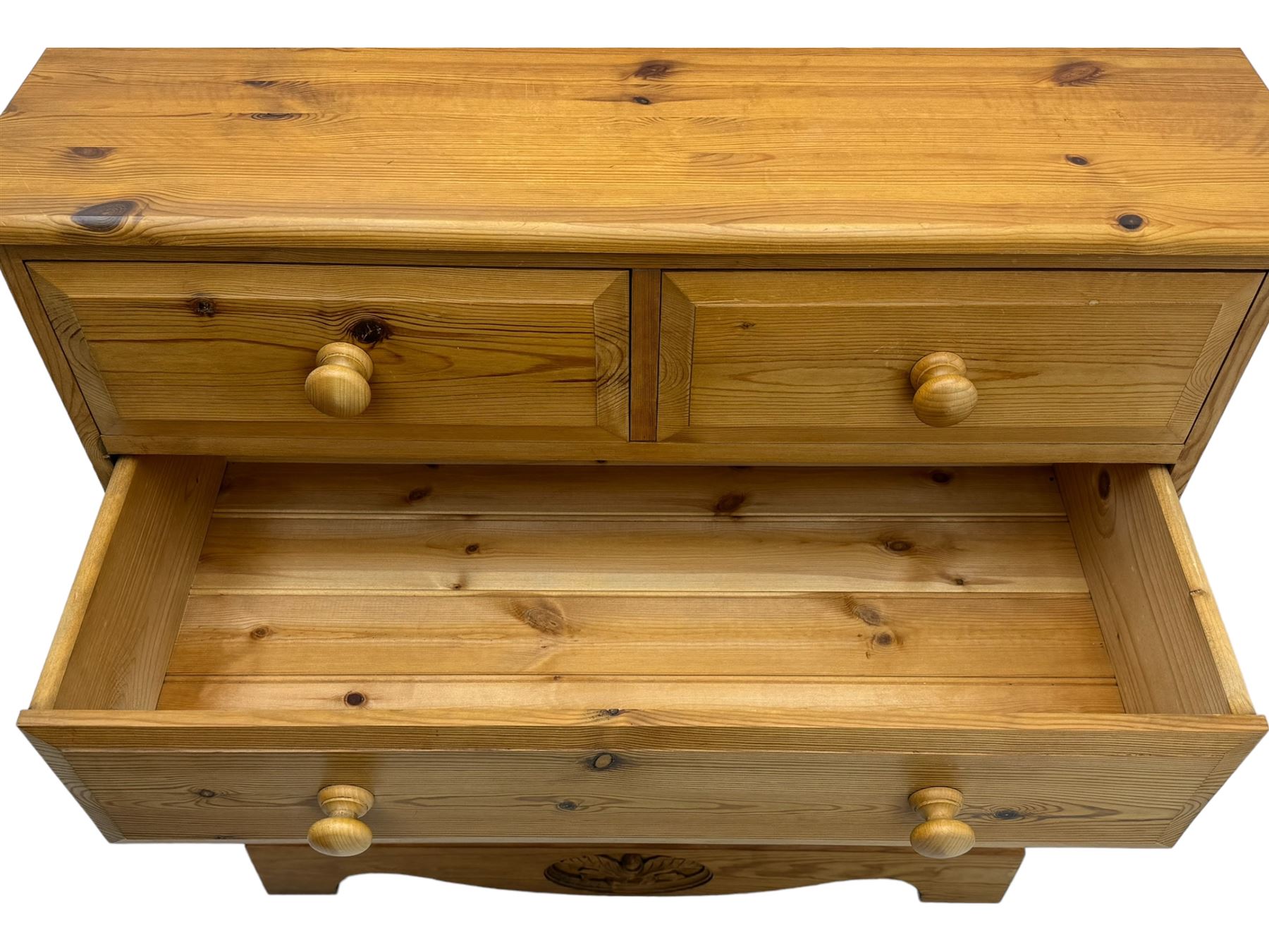 Pine chest of drawers topped with carved pediment with acorn and oak leaf motif, fitted with two short over three long drawers, standing on shaped apron base (W92, D46, H97cm); pine bedside cabinet, single drawer above paneled cupboard door enclosing open storage, shaped plinth base (W43, L32, H67cm)