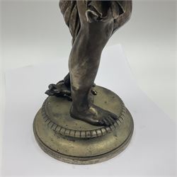 20th century silver plated figure, modelled as a classical male figure, possibly Prometheus, holding flames, one foot resting atop a small dragon, upon a circular spreading base, overall H37.5cm
