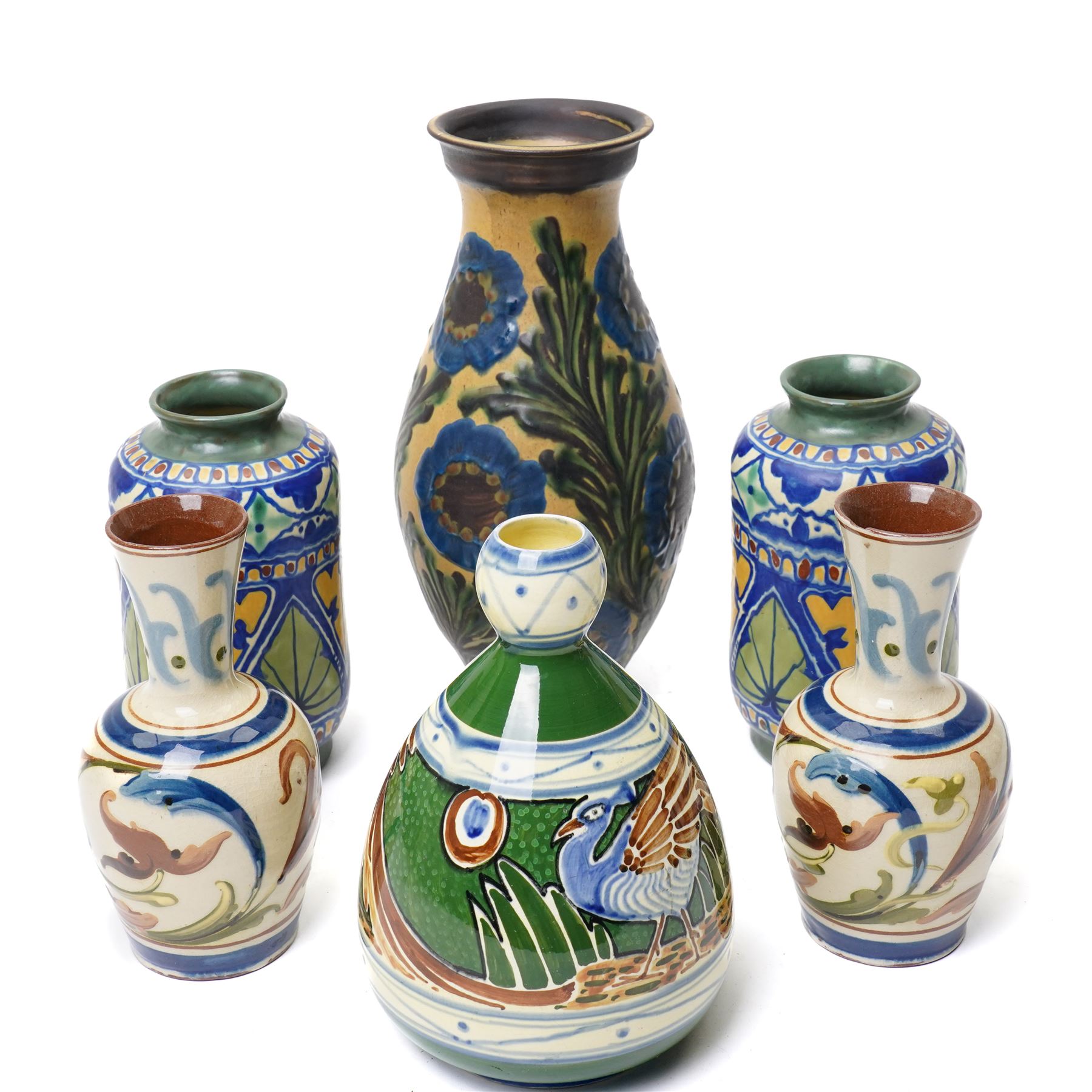 Thomas Forrester & Son Trogon Ware vase, c1920-1930, of baluster form with bulbous neck, painted with a band of peacocks, signed, H21cm; together with a pair of vases designed by James Plant, signed to base, H19cm, a Herman August Kahler (Danish 1846-1917) vase, of elongated form, signed to base, H29cm, and two further vases (6)