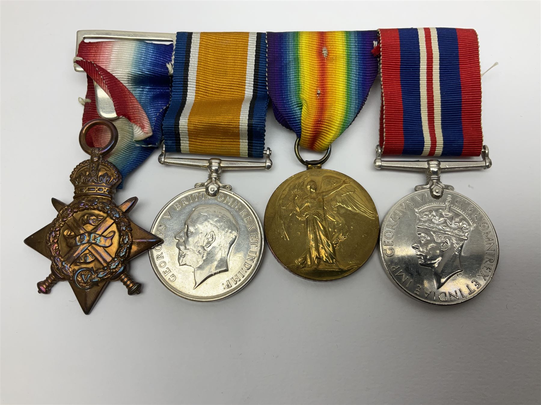 WW1 group of three medals comprising British War Medal, Victory Medal and 1914 Star awarded to 8328 Pte. G. Shaw Yorks: L.I.; on hanging bar with WW2 1939-1945 War Medal and WW1 ribbon bar with rosette to 1914 Star ; all with ribbons; and WW2 1939-1945 War Medal with ribbon