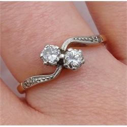 18ct gold two stone diamond cross over ring, with diamond chip shoulders, diamond total weight approx 0.30 carat