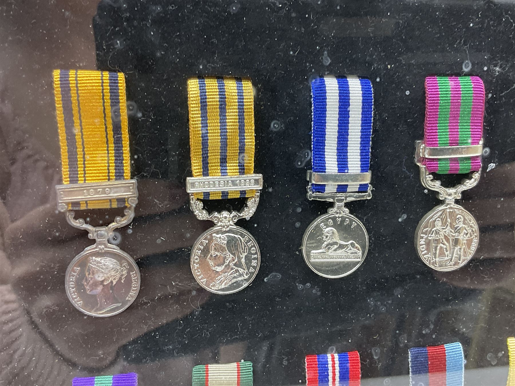 Limited edition large framed display board with sixty half-size copies of British Gallantry and Campaign Medals produced by Danbury Mint; all with ribbons and associated booklet