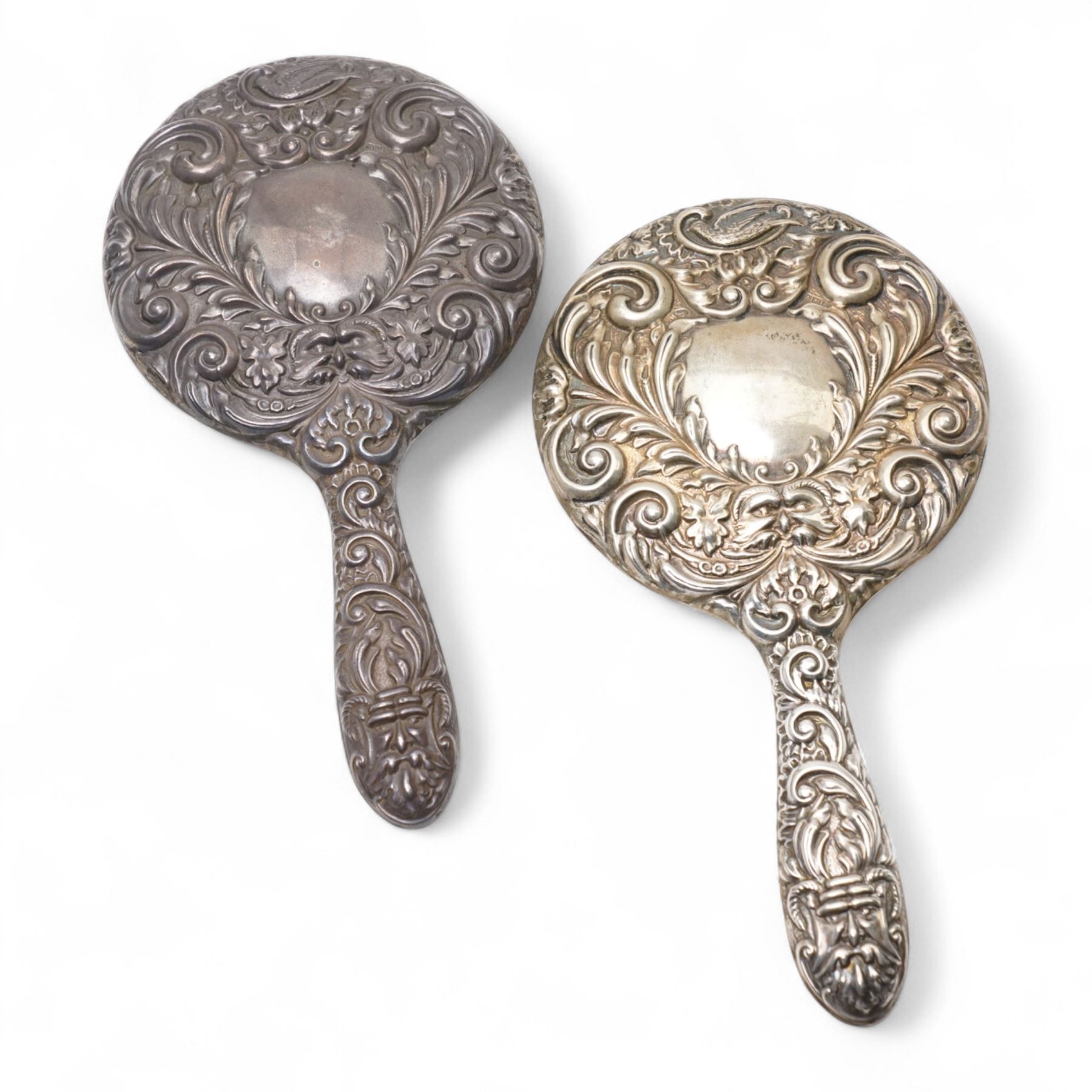 Pair of silver backed hand mirrors, clothes brush and hair brush (4)