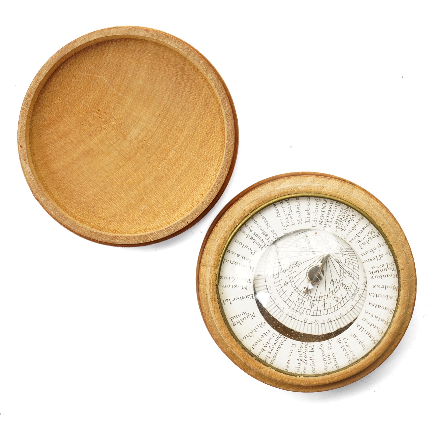 19th century pantochronometer, with central compass under domed glazed cover, within a turned lidded sycamore case, with patent pantochronometer label beneath