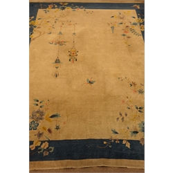  Large early 20th century Chinese carpet, beige ground with blue band border, decorated with flowers, butterflies and hanging lanterns, 407cm x 334cm  