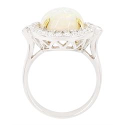 18ct white gold opal and diamond cluster ring, single cabochon cut opal of approx 5.20 carat, surrounded by round brilliant cut diamonds, in a milgrain setting, stamped 750, total diamond weight approx 0.55 carat