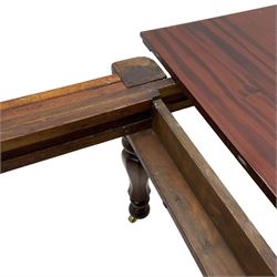 19th century mahogany extending dining table with three additional leaves, rectangular top with rounded corners, pull-out action, on turned and faceted supports with brass castors