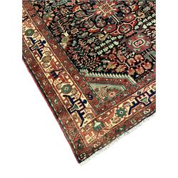 Persian Malayer rug, the field decorated with tree of life, floral, animal and bird motifs, surrounded by three band border with geometric design