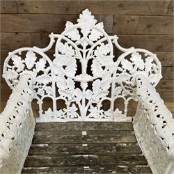 20th century Coalbrookdale design cast iron oak leaf and acorn armchair, white painted cast iron frame with slatted wooden seat, the pierced and shaped back decorated with scrolling oak branches and leafage, flanked by dog mask arm terminals over cabriole supports with paw feet