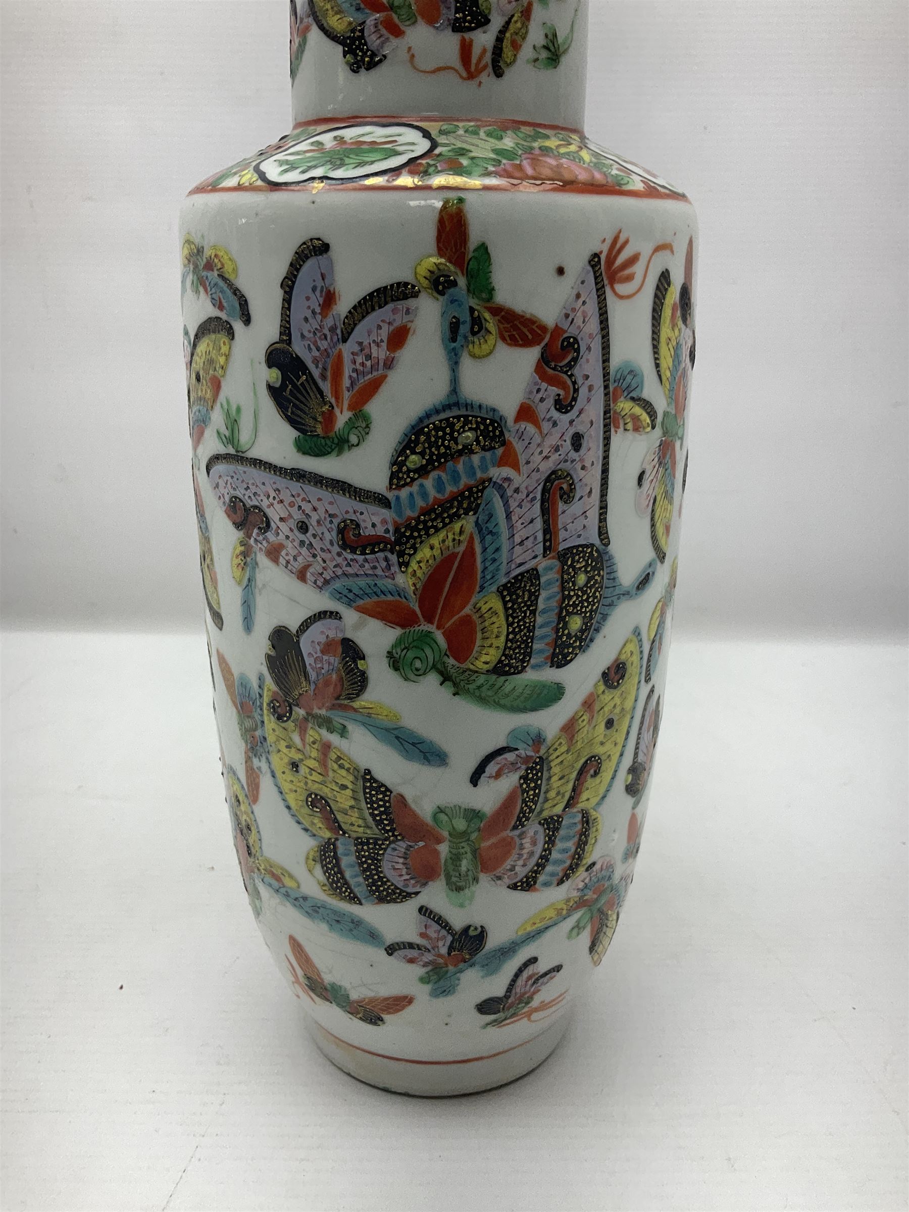 19th century Chinese Canton vase of slender baluster form, decorated with butterflies and floral panel to the neck, H30cm