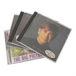 Elton John books and CDs, including first edition 'Rocket Man' book by Chris Roberts, Scattershot by Bernie Taupin signed by the author, thirteen CDs including double and triple examples and a Elton John Live at madison Square Garden DVD