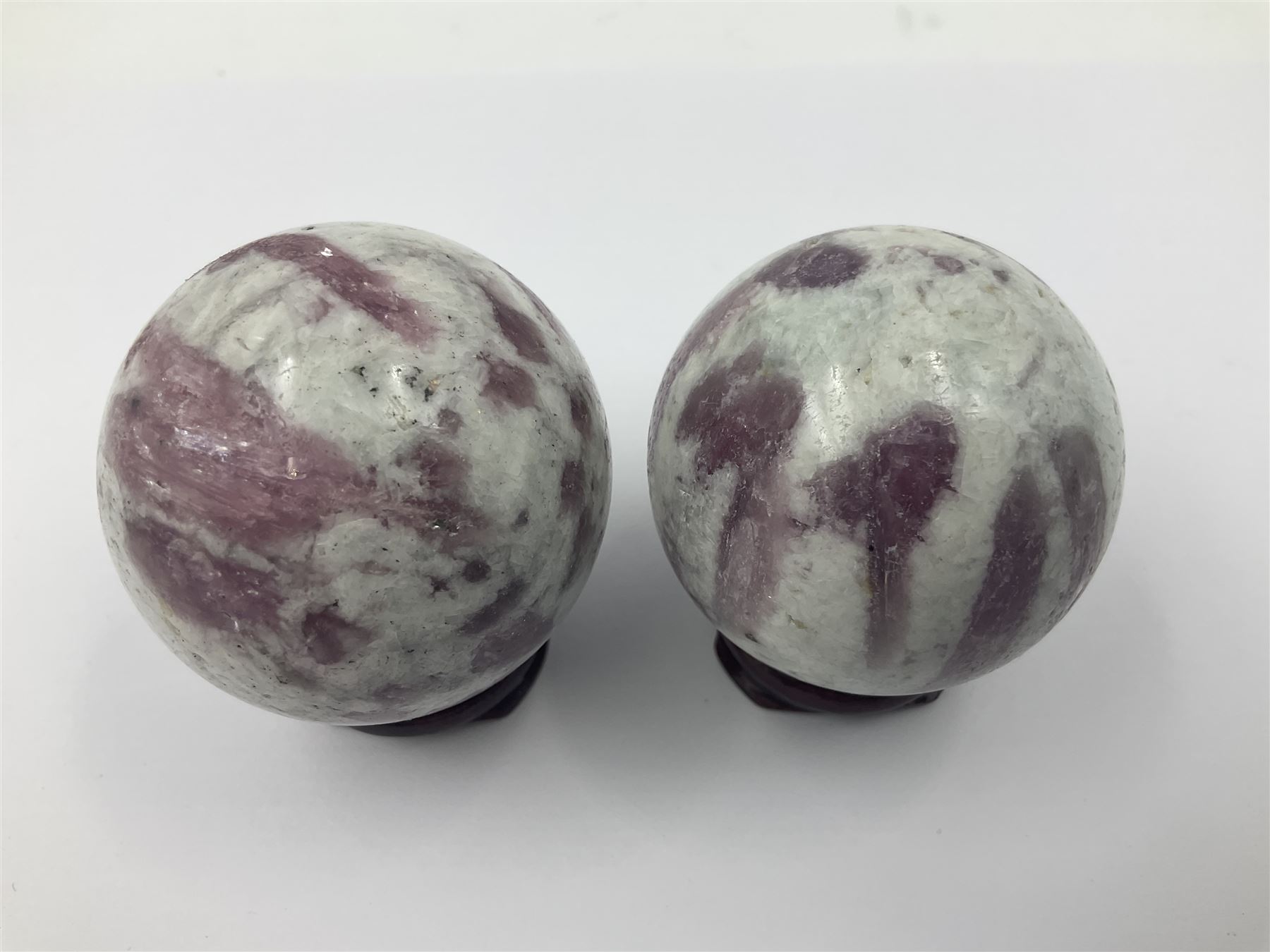 Pair of pink tourmaline spheres, upon gilt metal stands, H9cm D5cm
