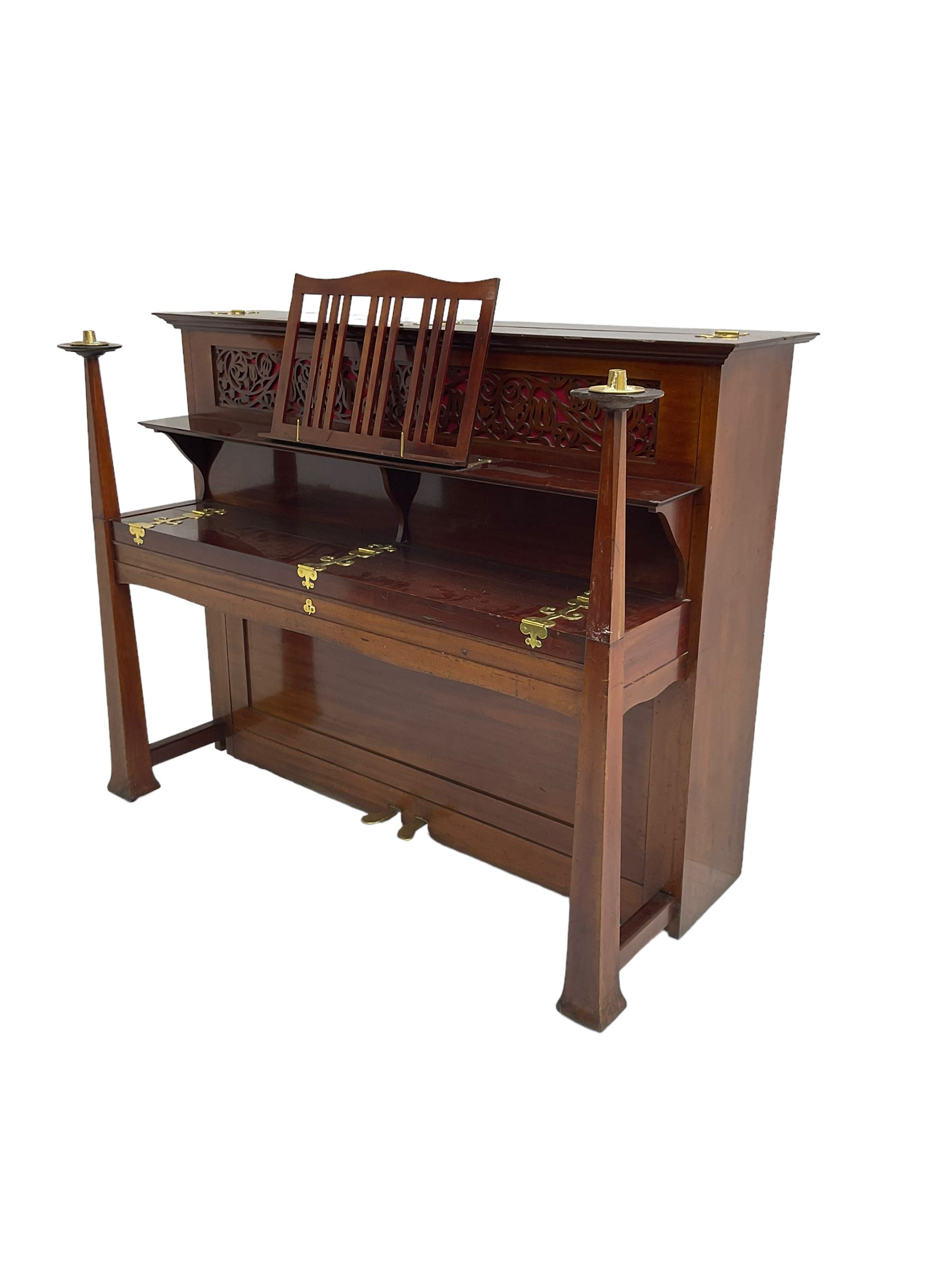 Carl Bechstein - late 19th century German overstrung upright piano, in a model 4 Arts and Crafts case designed by Walter Cave, with a lattice music desk and fretted silk backed front panel, brass hinged case lid and key fall with square tapered candle holders and circular sconces, iron frame, serial number 52187 (1899-1900), with an under damper action, 85 ebony and ivory keys, sustain and una corda pedals, original action, stringing, dampers, and action return straps, registered case number 328639, USA patent 24805.

This item has been registered for sale under Section 10 of the APHA Ivory Act