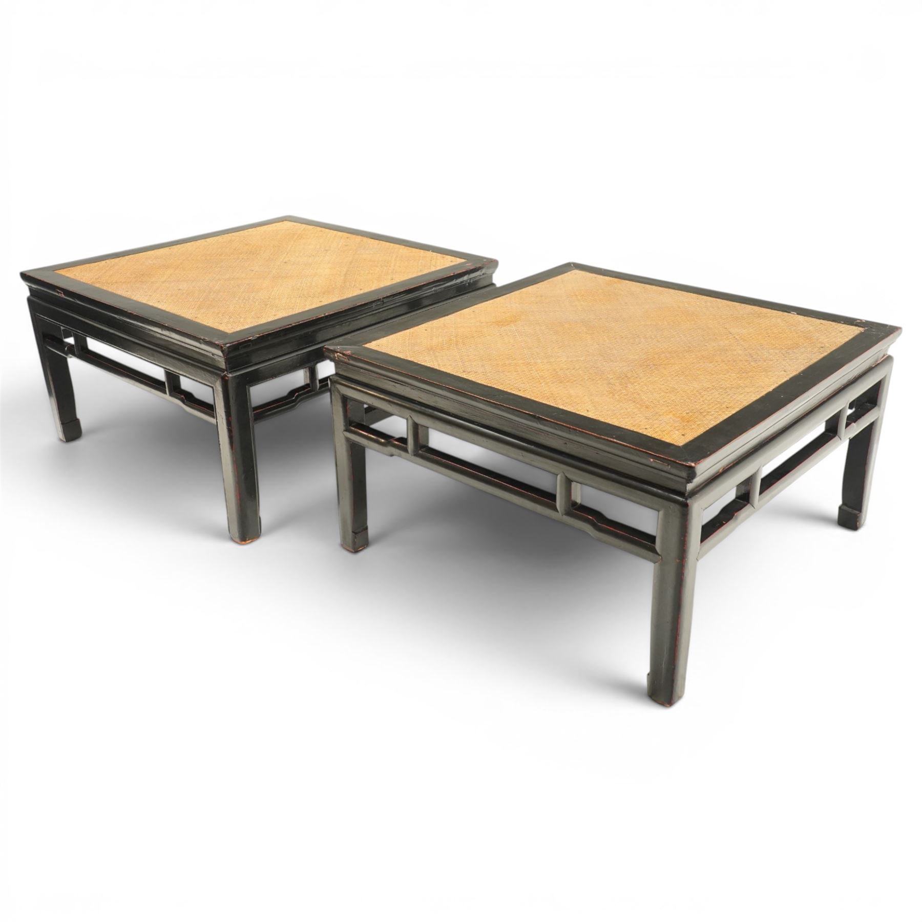 Pair of 20th century Chinese lacquered low coffee or lamp tables, square top with inset woven panel, over shaped frieze rails, raised on moulded square supports