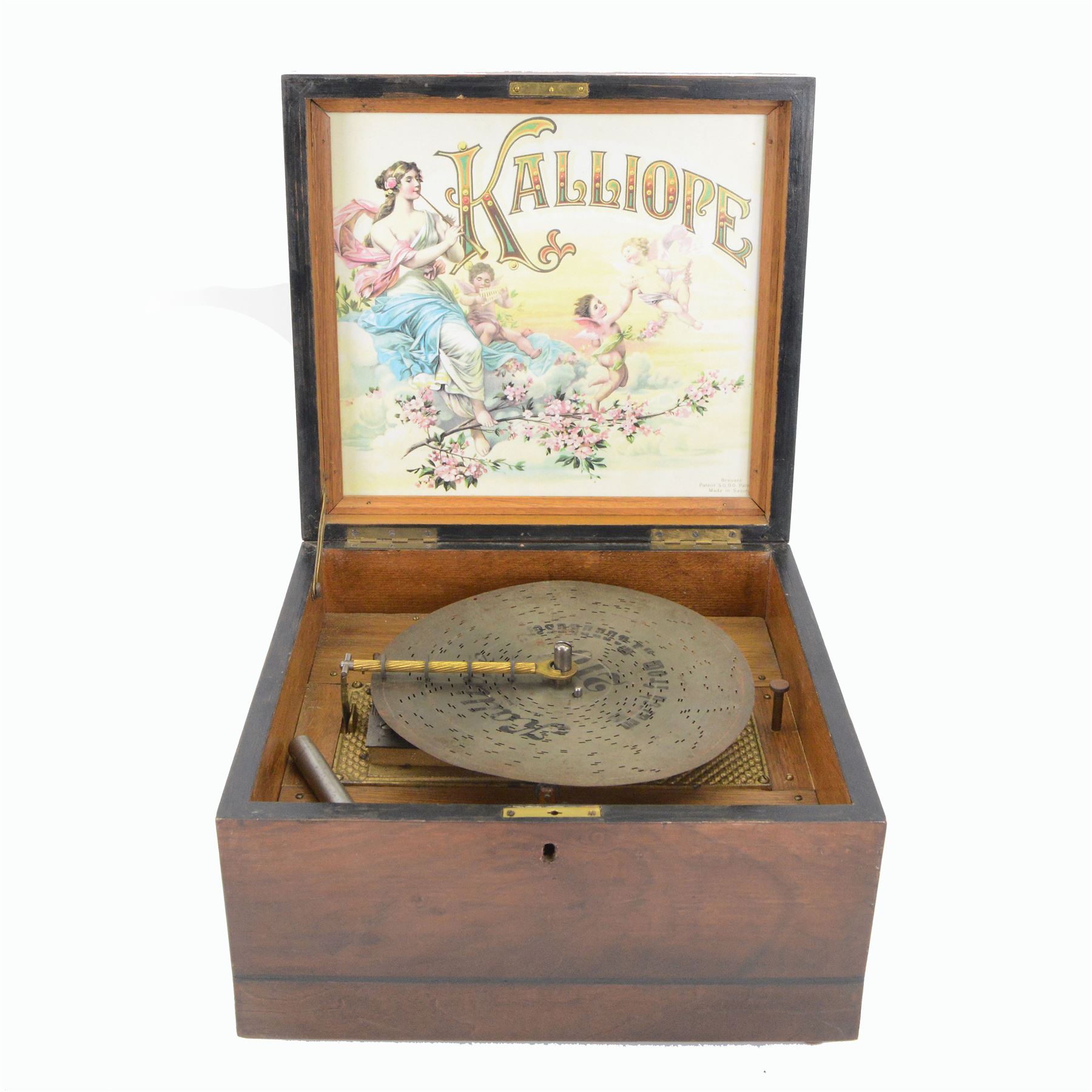 German-late 19th century Polyphon, in a mahogany finished case with a decorative inner Kalliope trade decal, with a 48 tooth steel comb on a gilt cast base and central driving spindle, with six bells and hammers and one 9-1/8” disc. Serial No 113007. With Key.