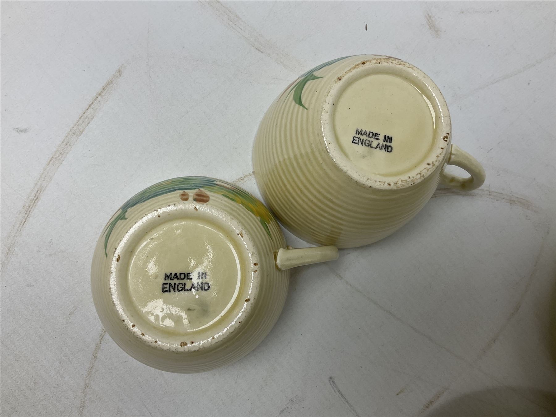 Wilkinson Clarice Cliff honeydew pattern tea service for eight, comprising teapot, milk jug, open sucrier, teacup and saucers, dessert plates and two side plates (29)