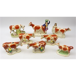  Five 19th century Staffordshire Cow Creamers on shaped bases with milkmaids and pails, two Staffordshire Cows and Milkmaids and one other, H24cm (8) Provenance: From a Private Yorkshire Collector  
