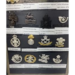Collection of thirty-two reproduction military badges, including Royal Scots Fusiliers, Royal Lincolnshire Regiment, The Boarders Regiment etc. 