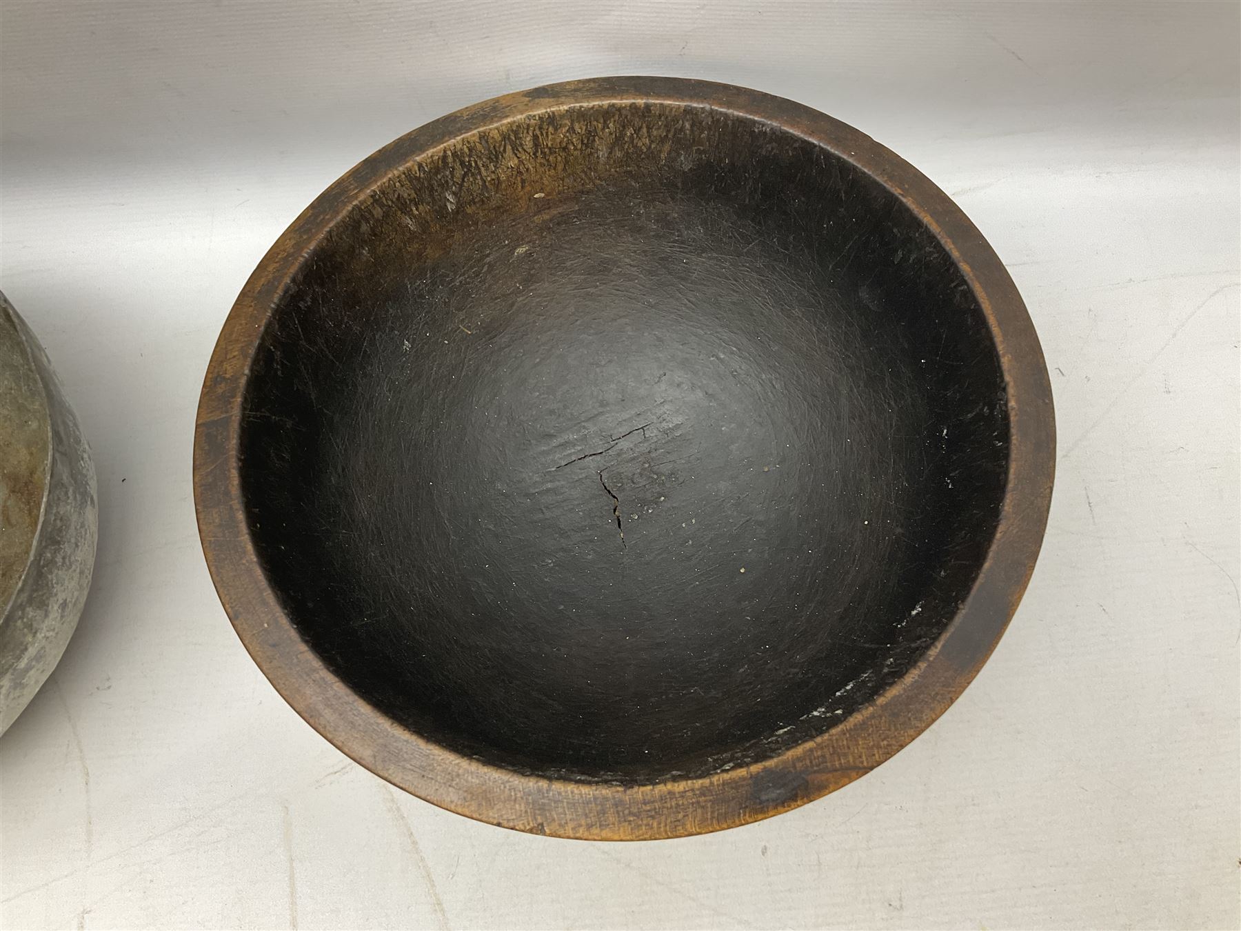 19th century pole lathe turned sycamore bowl, the interior housing lead liner, the exterior decorated with bands of deep grooves, D28cm
