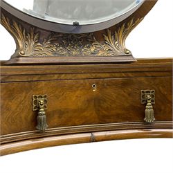 Early 20th century figured walnut kidney shaped dressing table, fitted with central swing mirror on back flanked by bevelled oval mirrors on circular revolving platforms, each on foliate carved supports, fitted with three drawers, raised on cabriole supports with moulded gilt scallop shells, with matching stool