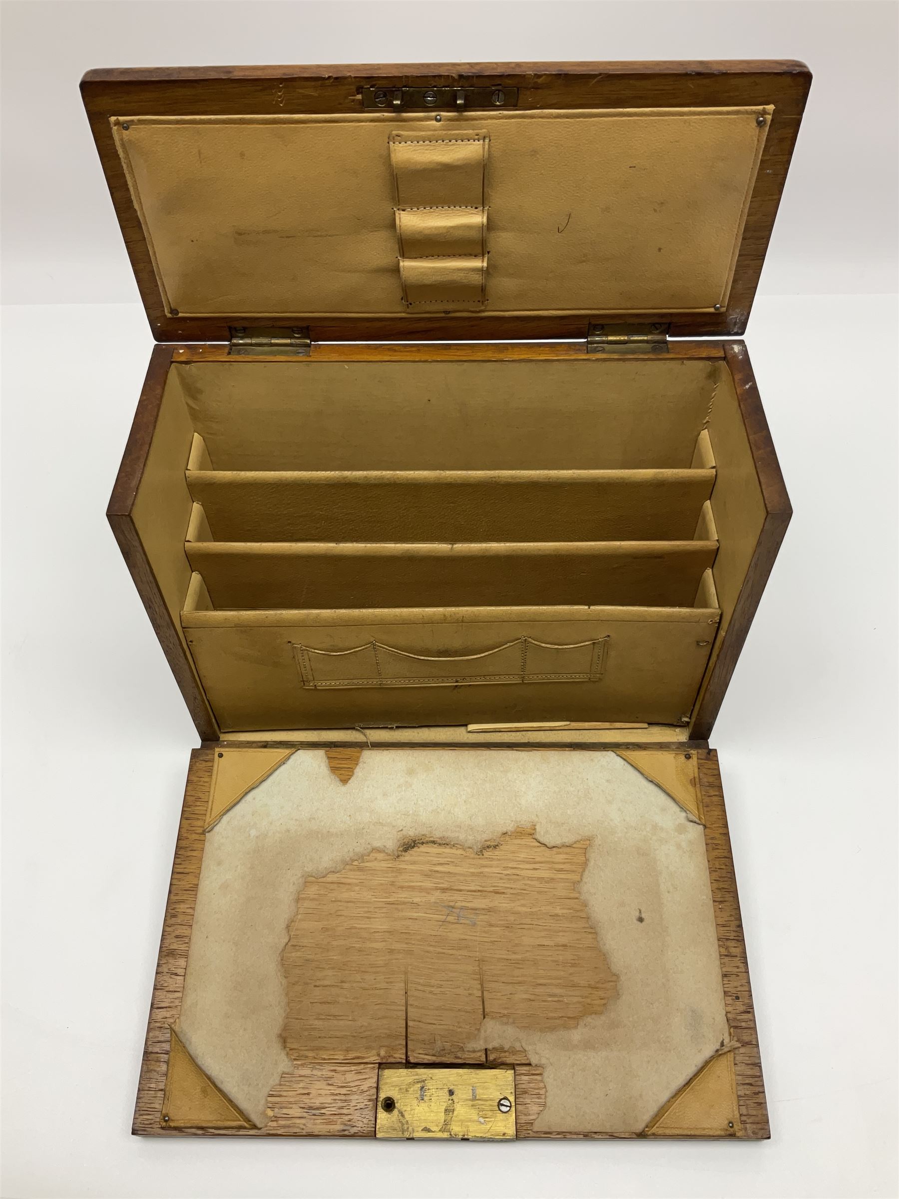 Wooden table stationery box, with drop down front and fitted interior, with metal shield plaque to the hinged lid, H18cm