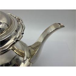 1920s five-piece silver tea service, comprising teapot, coffee pot, hot water pot, twin handled open sucrier and milk jug, each of squat circular form with shaped rim, the teapot, coffee pot and hot water pot each with ebonised handle and finial, the sucrier and milk jug with acanthus capped scroll handles, all upon circular foot, hallmarked R F Mosley & Co, Sheffield 1926 & 1927, tallest H24cm