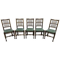 Set of five Lancashire design elm spindle back chairs, shaped cresting rail over two rows of five spindles, upholstered drop-on seats, on turned front supports united by turned stretchers  