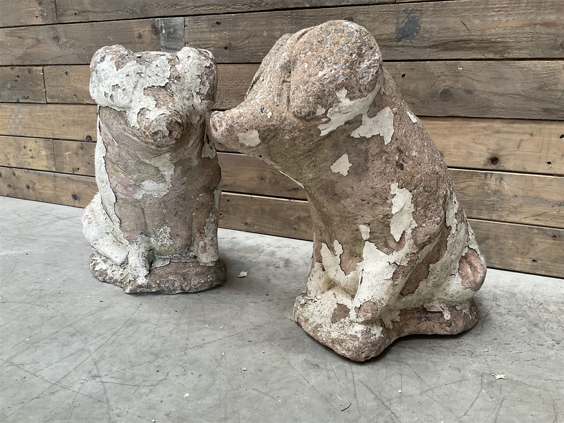 Pair painted stone pigs 