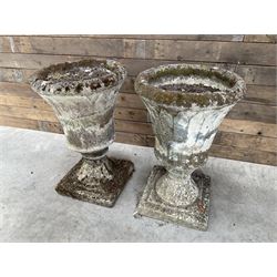 Pair of Regency design weathered cast stone garden urns