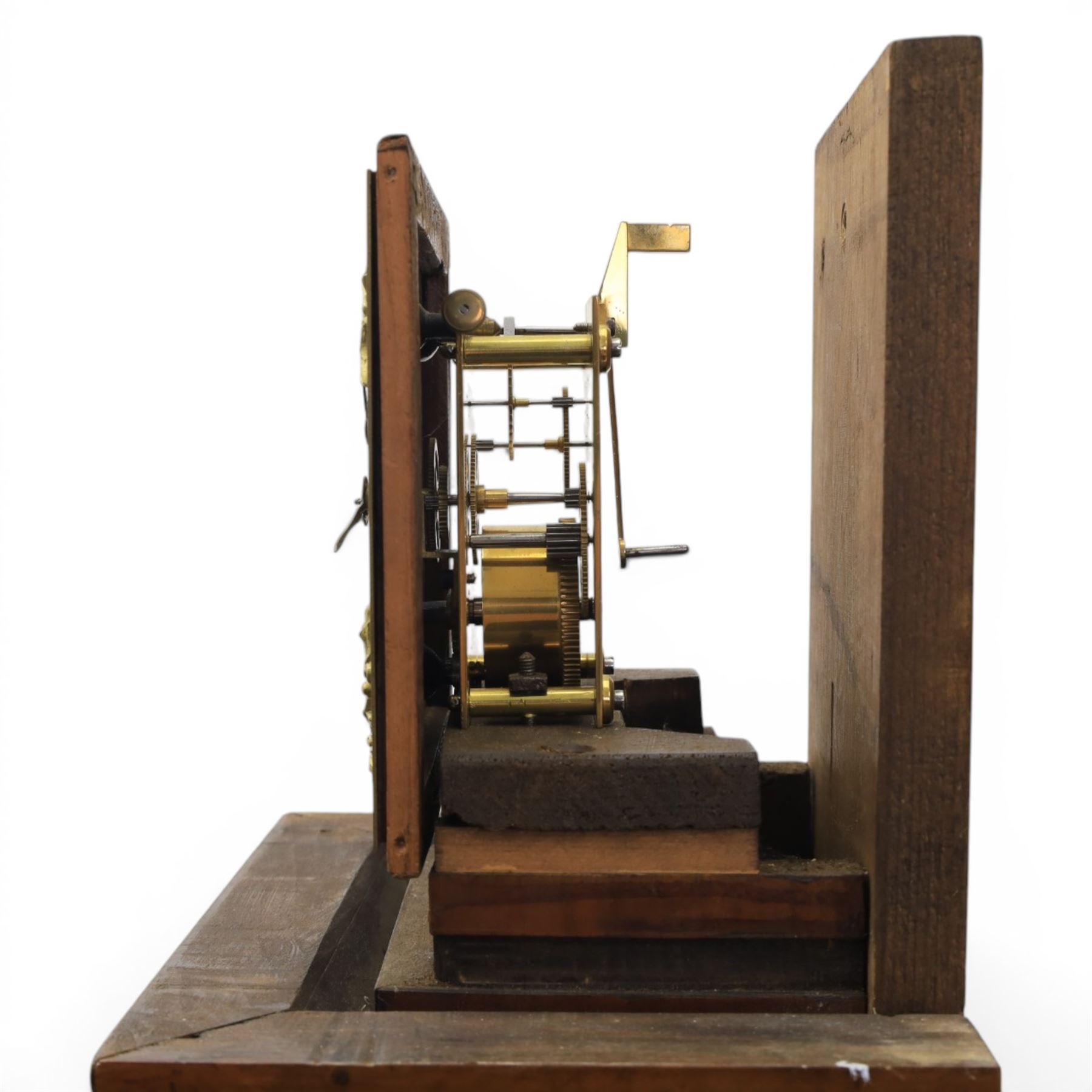 Early 20th century walnut small longcase clock, brass dial with silvered Roman numeral chapter ring and pierced black hands, the figured walnut case with shaped projecting hood, long moulded trunk door and stepped plinth base