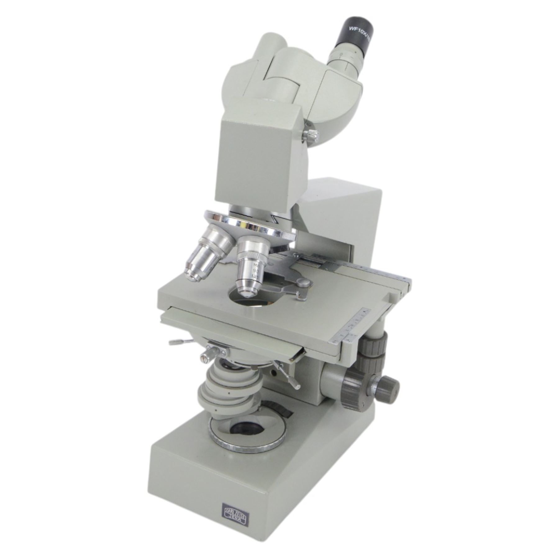 Three microscopes, including Griffin Student Vernier Microscope, Vickers Instruments binocular microscope with Leitz Wetzlar Periplan 10x lenses, and a Carl Zeiss Jena binocular microscope in a wooden Olympus Tokyo box