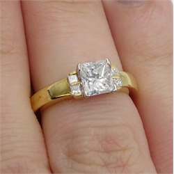  18ct gold princess cut diamond ring, the central diamond of approx 0.80 with two diamonds on either side by Hugh Rice, hallmarked  