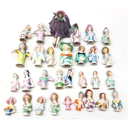  Collection thirty of ceramic pin cushion/ half dolls of varying sizes, including one with pin cushion base & legs, H10cm max   