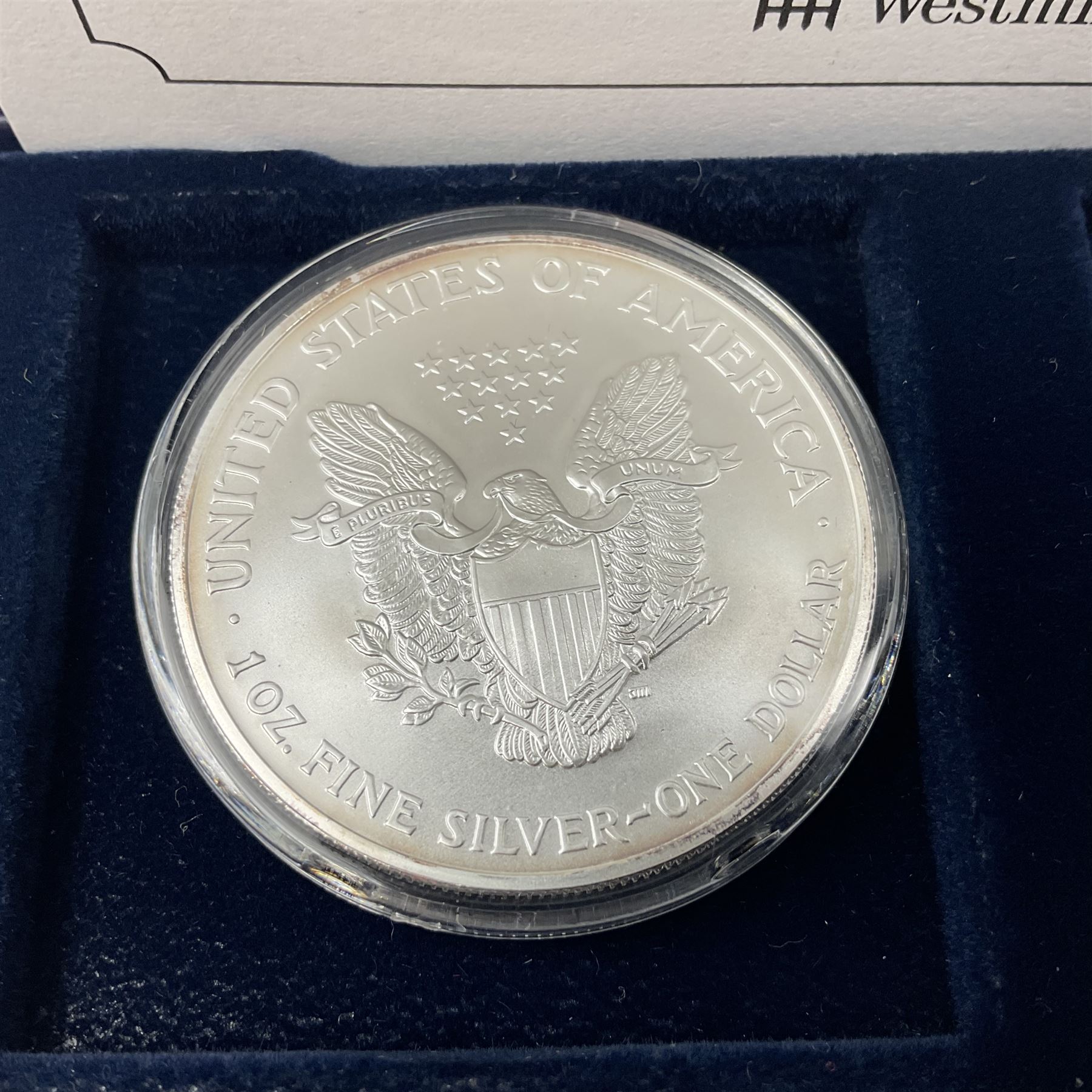 Four one ounce fine silver coins, forming 'The 2004 Famous World Silver Coin Collection', comprising United States eagle, Australian kangaroo, Chinese panda and Canadian maple leaf, cased with Westminster certificate 