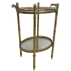 Gilt metal oval stand, two mirrored tray tiers with raised pierced galleries