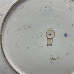 Early 18th century Delft marriage plate, of circular form with dished centre, the centre inscribed and dated 'Thomas and Elizabeth Kockerill Bridlington Key 1715' within a crowned C scroll cartouche, flanked by demi-griffins, above a putto head and tassels, within a wide foliate border, D34cm
