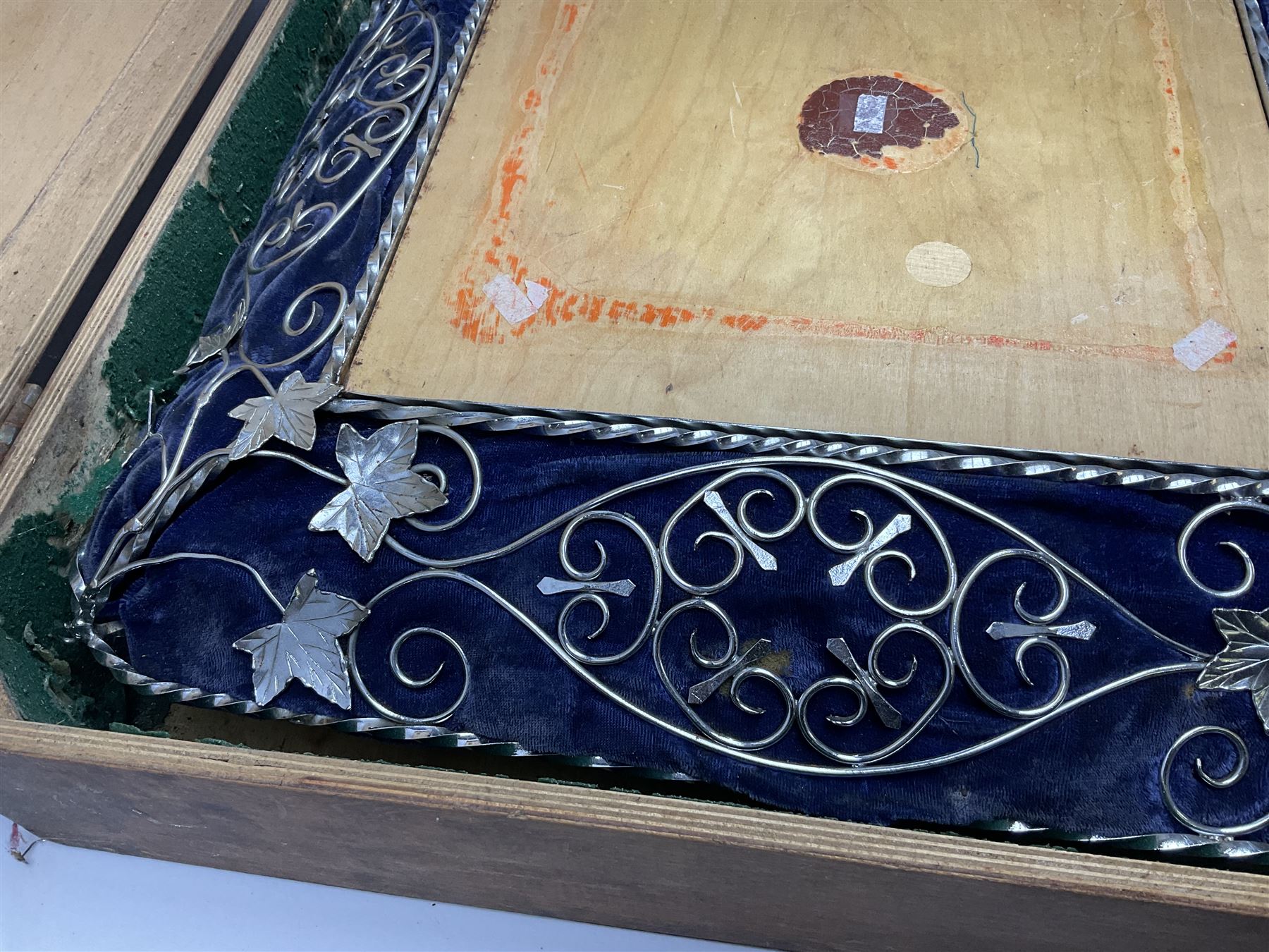 Edwardian wedding cake stand, the blue velvet cushion applied with wirework scroll, in wood box, 56cm X 56CM