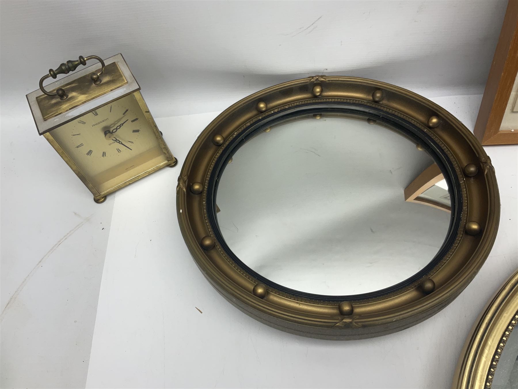 Two ceramic plaques by Richard Fisher, together with wooden plaques, artwork and three mirrors 