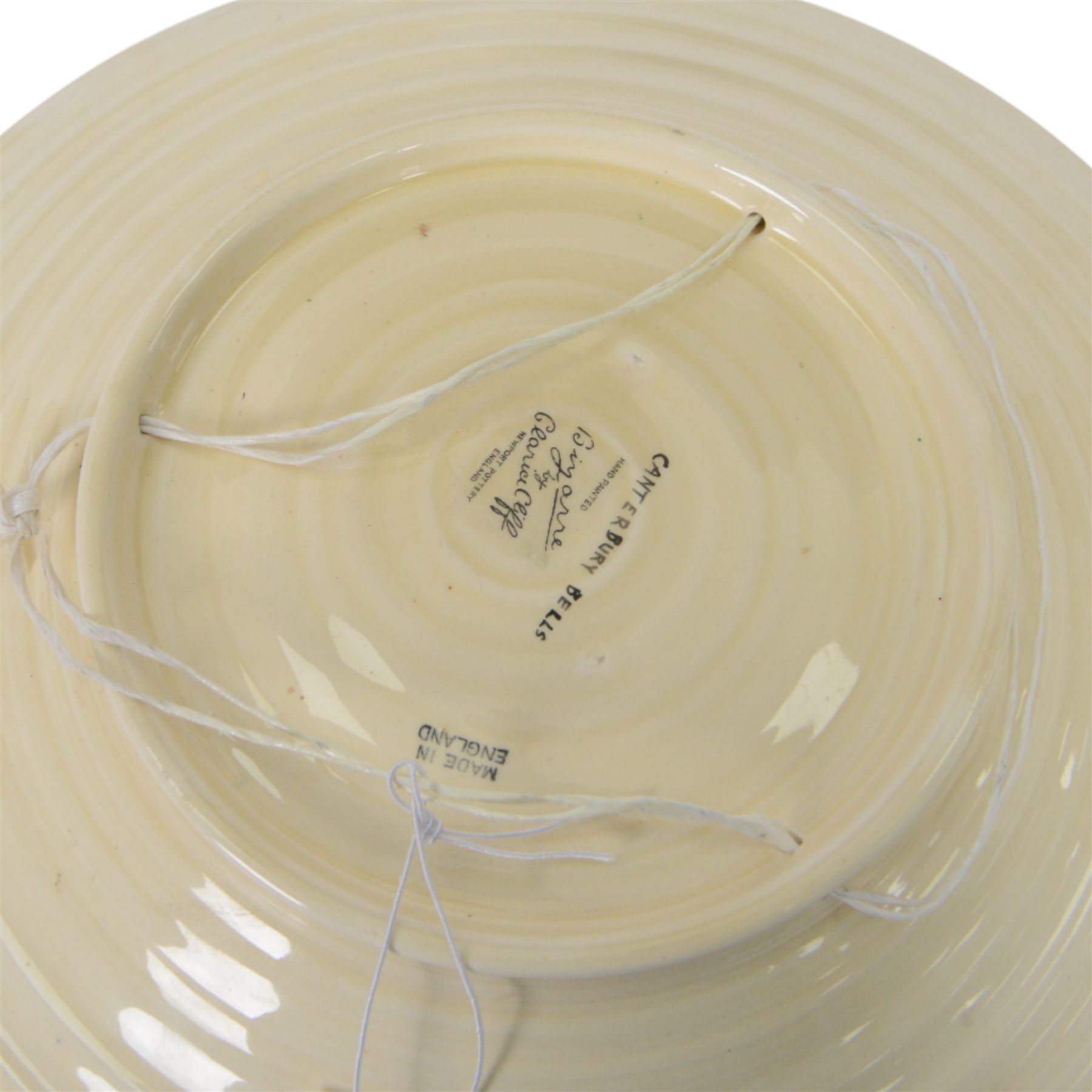 Clarice Cliff Bizarre for Newport Pottery dish, decorated in the Canterbury Bells pattern, with stylised flowers in blue, yellow and orange amongst foliage upon a brown and yellow ground, with printed mark beneath, D33cm