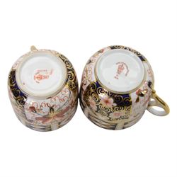 Royal Crown Derby imari pattern, miniature teapot and teacup, together with two cups and saucers and three plates