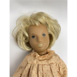 Sasha Morgenthaler vinyl doll, the girl's head with painted blue eyes and lips and short blonde hair, the jointed body donning a peach floral dress with matching underclothes, unmarked, H41cm
