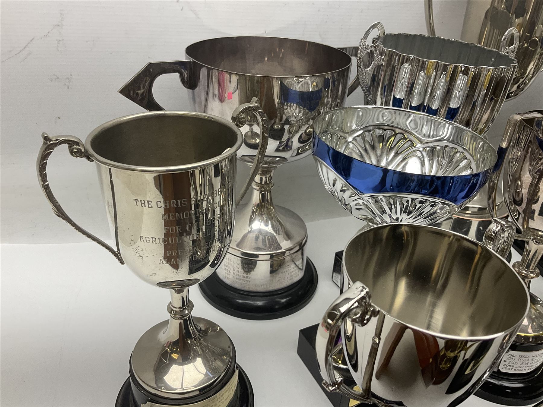 Collection of silver plated and metal trophy cups and winners plaques, all relating to the Burniston and District Show, most engraved with competitions and winner's names, in three boxes 