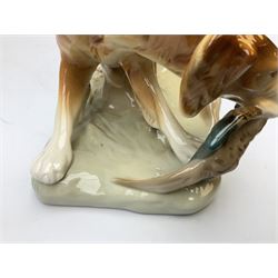 Royal Dux porcelain hunting dog with a bird, printed mark beneath, L36cm